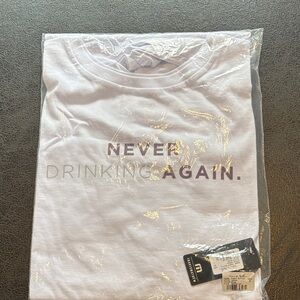 Travis Mathew White Tee with Purple Text